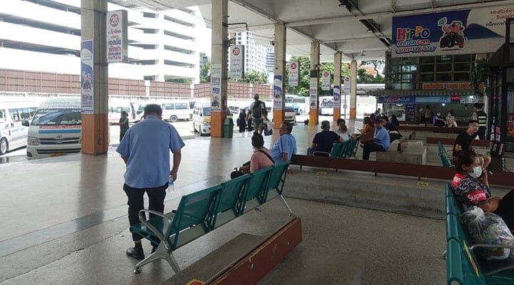 Passengers awaiting their bus departures at Ekkamai Eastern Bus Terminal in Bangkok, Thailand, on July 10, 2023, with buses servicing routes to Trat, Pattaya, and Rayong.