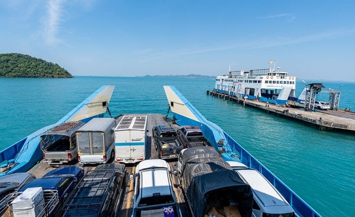 Ferry loaded with cars departing Trat province for Koh Chang island in Thailand.