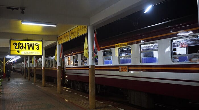 Train stopped at Chumphon Railway Station at night.